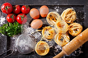 Fresh pasta with ingredients for cooking