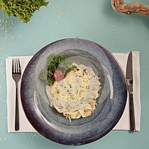 Fresh pasta and ingredients. pasta with cheese in a dark plate