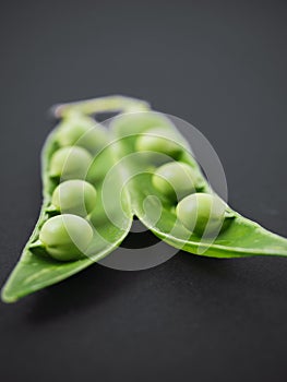 Fresh pea pod and green peas
