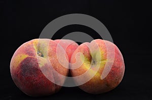 Fresh Peaches Isolated on Black Background