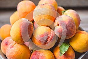 Fresh peaches with leaves.