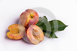 Fresh peaches, nectarines isolated on a white background