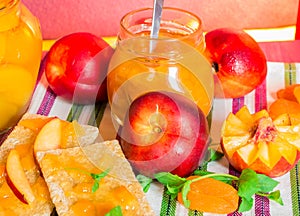 Fresh peaches and peach jam.