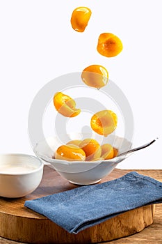 Fresh peaches in syrup in the bowl