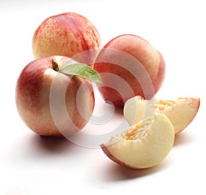 Fresh peaches whole and halved