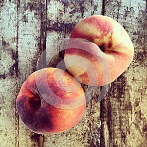 Fresh peaches on wood