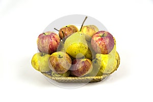 Fresh pear apples in wicker basket with water droplets isolated on white background. Vegetables fruits. Useful