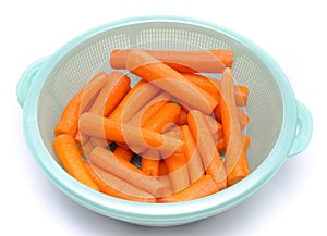 Fresh peeled carrots in a bowl