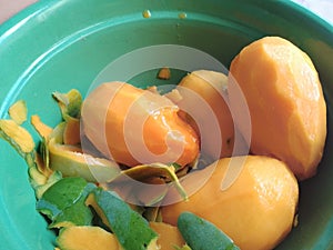 fresh mango fruit on the green bowl