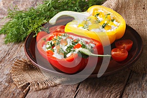 Fresh peppers filled with curd and dill close-up horizontal