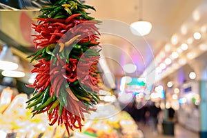 Fresh peppers hanging at market