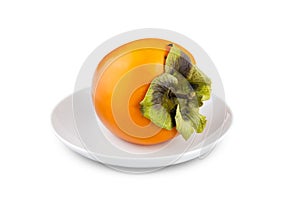 Fresh persimmon on white porcelain saucer, Isolated on white background.