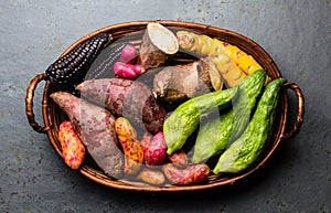 Fresh peruvian Latin American vegetables caigua, sweet potatoes, black corn, camote, yuca photo