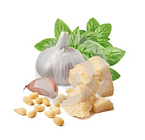 Fresh pesto ingredients, green basil, garlic clove, parmesan cheese and pine nuts isolated on white background