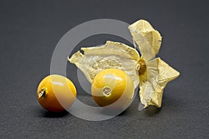 Fresh physalis fruits on black background