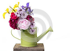 Fresh picked flowers in watering can