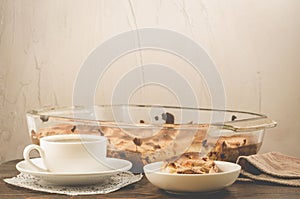 fresh pie and cup of fragrant black coffee/fresh pie and cup of black coffee on a wooden table and stone background, selective