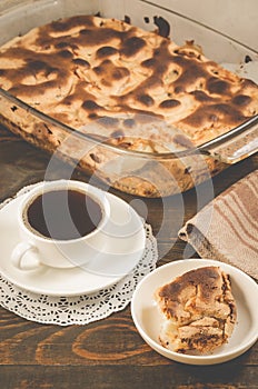 fresh pie and cup of fragrant black coffee/ fresh pie and cup of fragrant black coffee on a wooden background