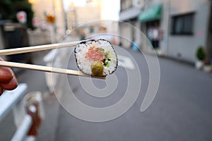 Fresh piece of japanese tuna sushi on the street of Osaka