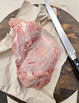 Fresh piece of meat with knife