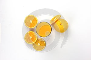 Fresh pieces Orange juice in glass isolated on white background, fresh orange jiuce drink, healthy drink in summer concepts,