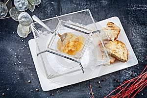 Fresh Pike caviar or roe in glass blow, served on ice. luxury food. Healthy Seafood. Copy space for design. russian cuisine