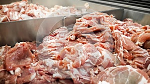 Fresh Pile of Sliced Pork at the Butcher`s