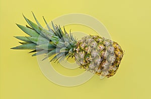 fresh pineapple isolated on yellow background