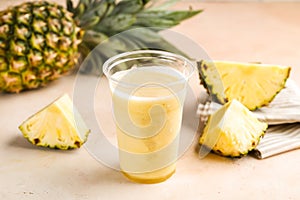 Fresh Pineapple Juice with raw slice served in glass isolated on table top view healthy morning drink