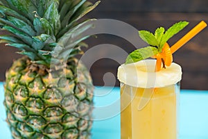 Fresh pineapple juice or smoothie in a tall glass