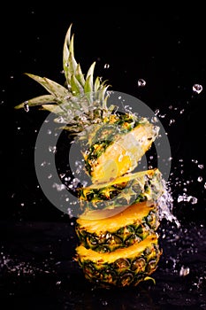 Fresh pineapple in splash water