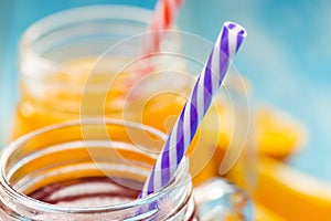 Fresh pineapple and strawberry smoothie in glasses with fruits