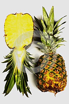 Fresh pineapple on white background, cut on half and whole pineapple, ananas