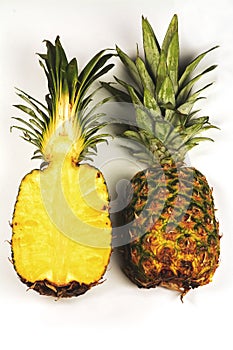 Fresh pineapple on white background, cut on half and whole pineapple, ananas