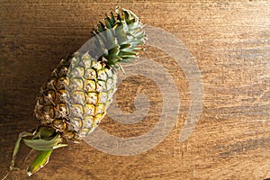 Fresh pineapple on wooden background.