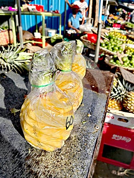 Fresh pineapples on sale in Vacoas market fair, Mauritius
