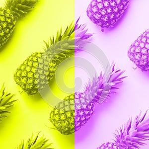 Fresh pineapples on trendy neon yellow and violet color background. Top View. Pop art design, creative concept. Copy Space. Bright