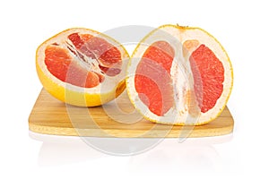 Fresh pink grapefruit isolated on white