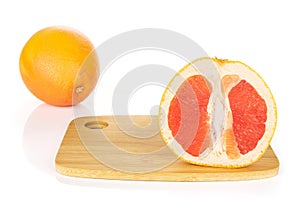 Fresh pink grapefruit isolated on white