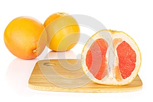 Fresh pink grapefruit isolated on white