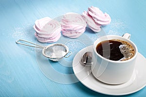 Fresh pink homemade zephyr - marshmallow and white cup of tea