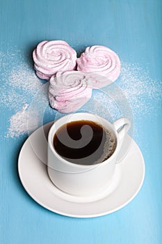 Fresh pink homemade zephyr - marshmallow and white cup of tea