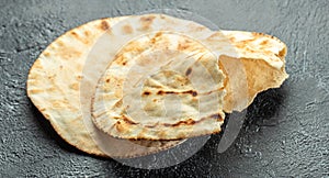 fresh pita bread. Traditional Arabic cuisine. Food recipe background. Close up