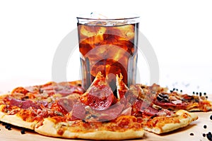 Fresh pizza and cold cola drink