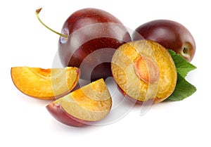 fresh plum fruit with cut plum slices isolated on white background