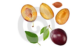 fresh plum fruit with green leaf and cut plum slices isolated on white background. top view