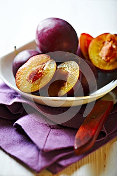 Fresh plums in a bowl