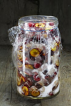 Fresh plums canned with sugar for jam, chutney or plum liqueur