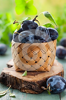 Fresh plums with leaves