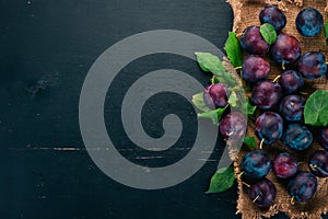 Fresh plums with leaves. Fruits.